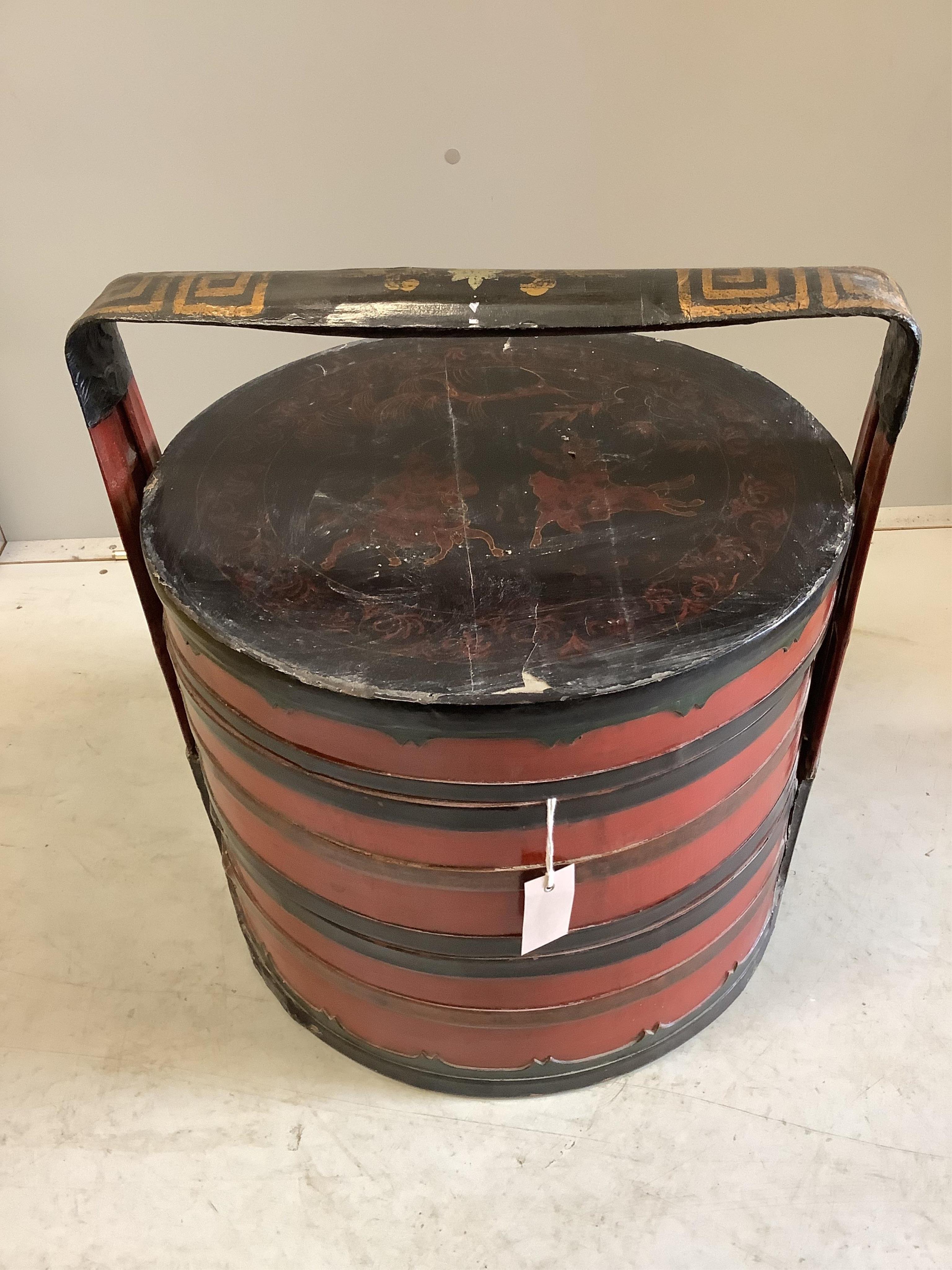 A Chinese lacquer circular sectional box, diameter 49cm, height 53cm. Condition - poor to fair